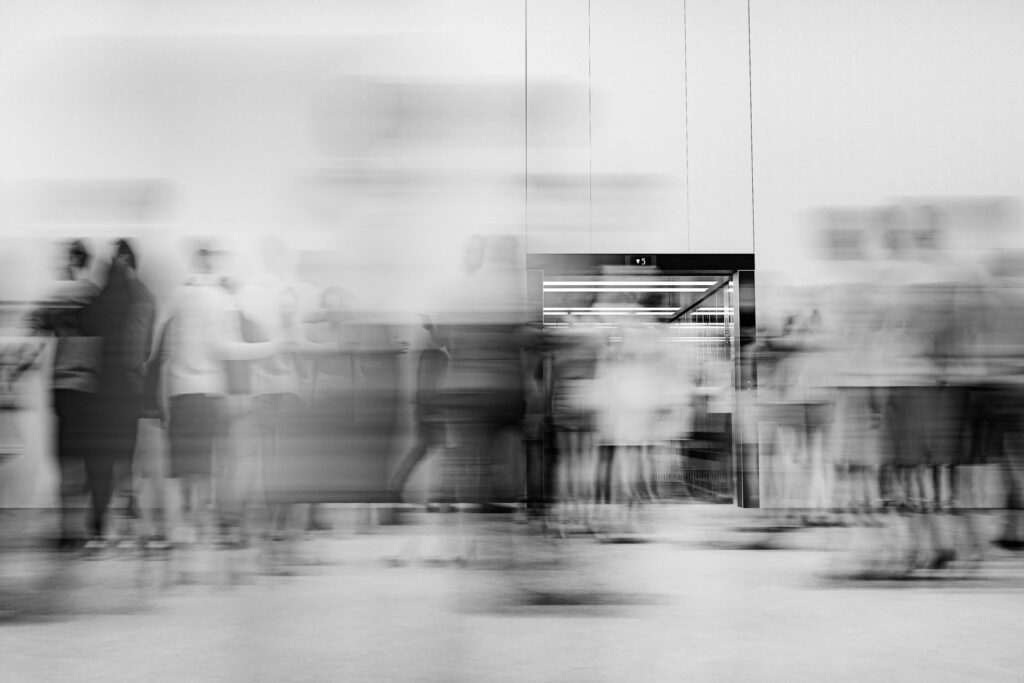 Office building lobby with business people in motion
